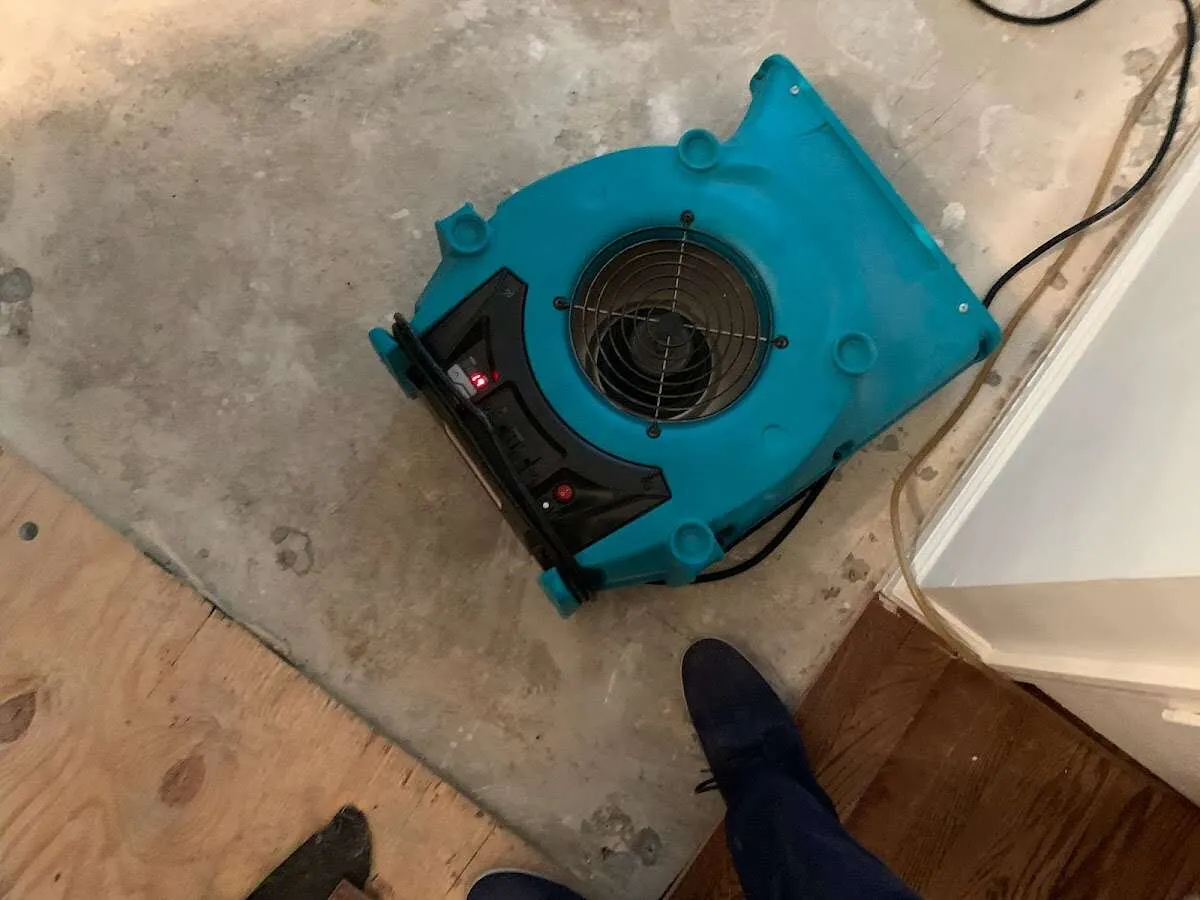 Air mover drying subfloor during Leak Detection & Repair in Redding